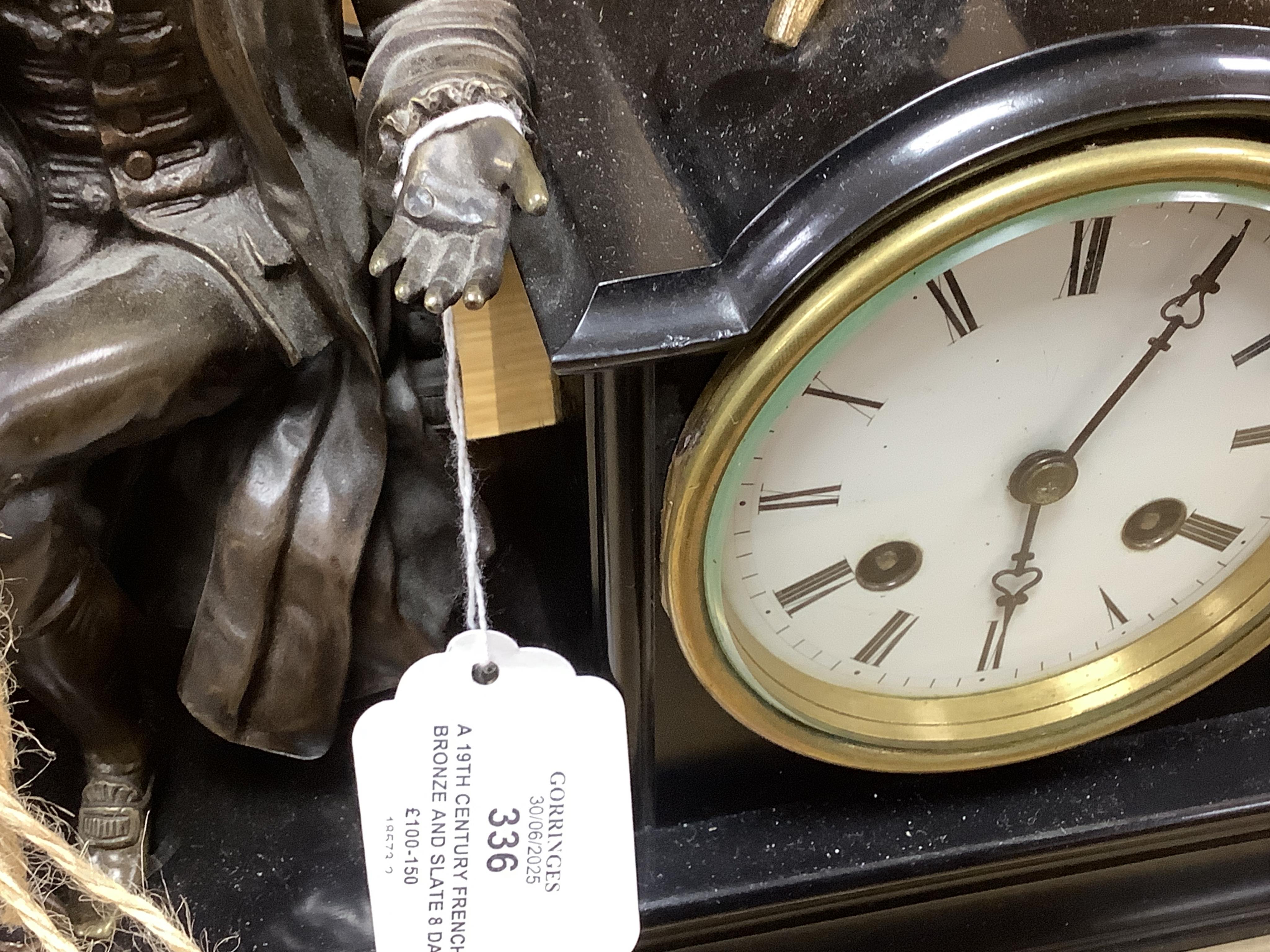A 19th century French bronze and slate 8 day mantel clock, mounted with figure of Denis Diderot (1713-1784), 40cm wide